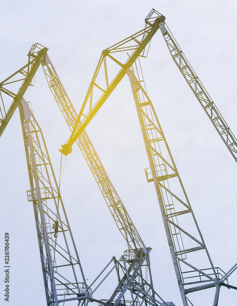 Lifting cranes inversion. Loading and construction.