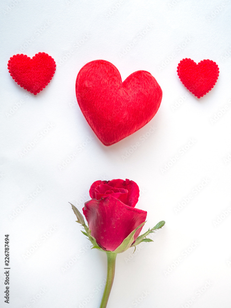 Red rose and red hearts on white background Red rose and red hearts on white background