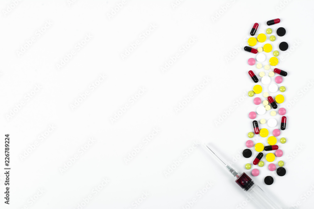 Many colorful pills and tablets isolated on white. vitamin pills. Collection of medicine pills on table.Lots of different medicine drugs, pills, tablets, capsules