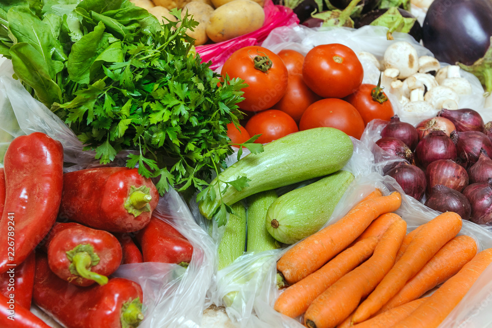 Close-up, different vegetables in plastic bags. In focus zucchini Close-up, different vegetables in plastic bags. In focus zucchini