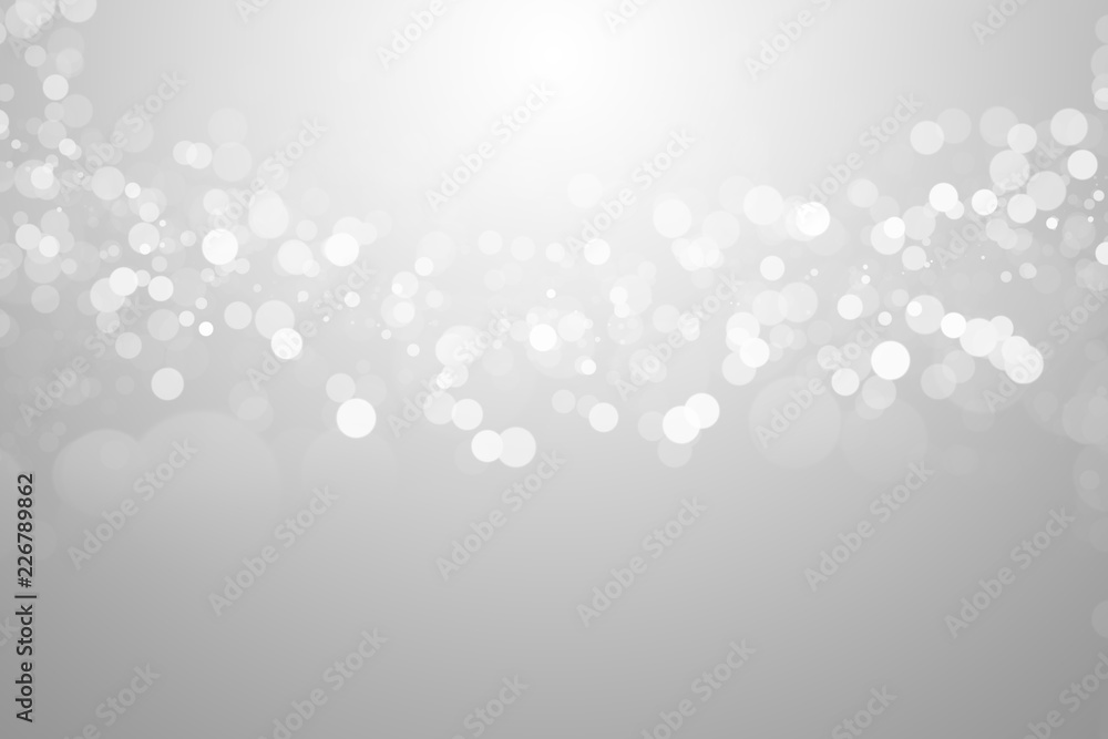 The bokeh on the blurred natural gray and white background.