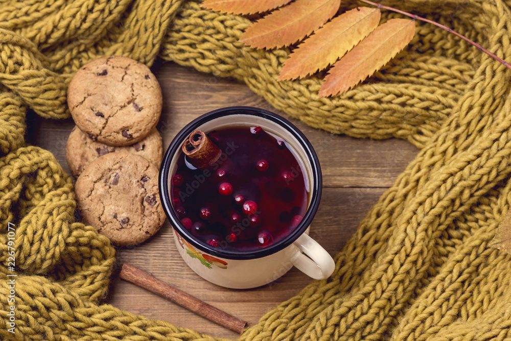 Top View of Cozy Autumn Morning at Home Breakfast With Hot Berries Tea Cookies Cinnamon Sticks Yellow Woolen Scarf Flat lay Top View of Cozy Autumn Morning at Home Breakfast With Hot Berries Tea Cookies Cinnamon Sticks Yellow Woolen Scarf Flat lay
