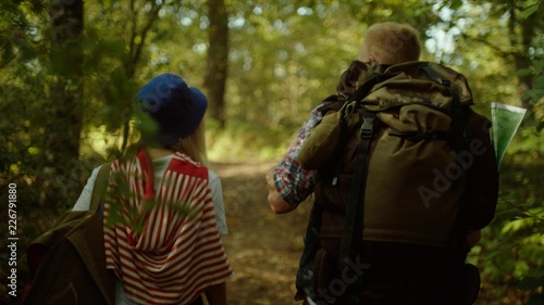 Backpackers couple hiking in the forest