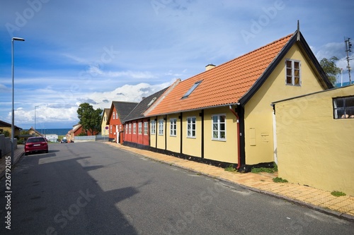 Traditional colorful half-timbered houses in the street leading towards harbor in Hasle, Bornholm, Denmark