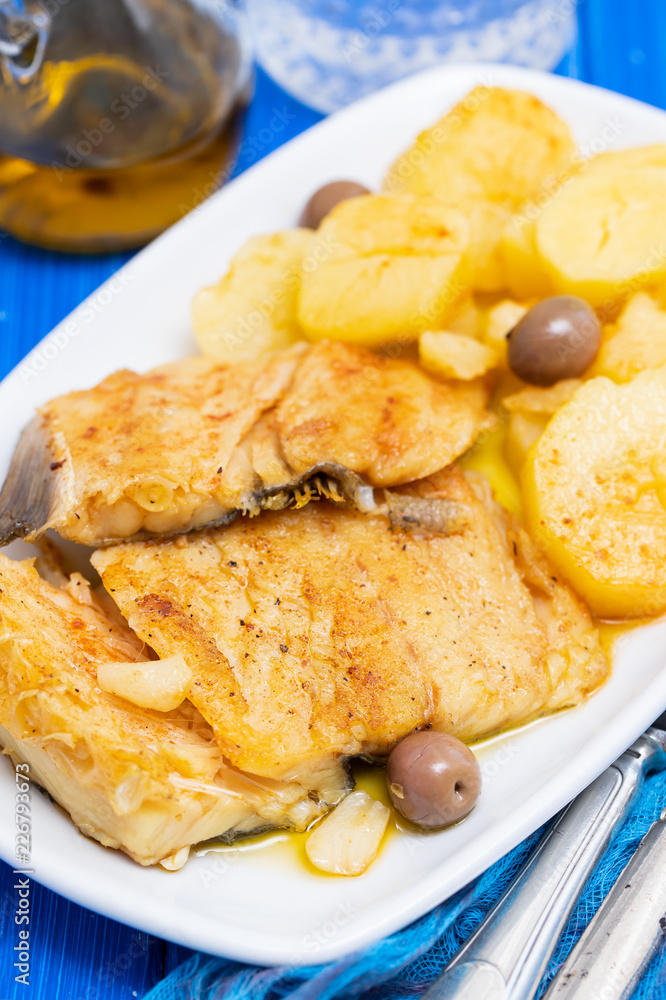 cod fish with fried potato on white dish cod fish with fried potato on white dish