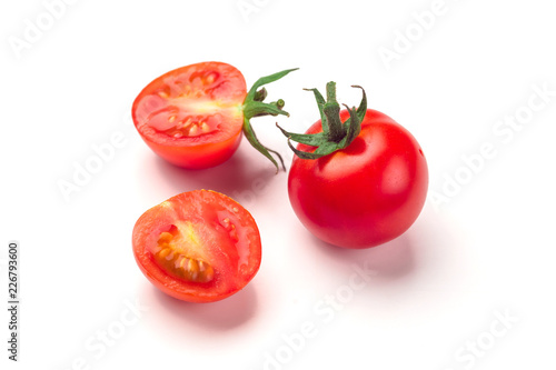 Close-up view of fresh tomato isolated on white background.