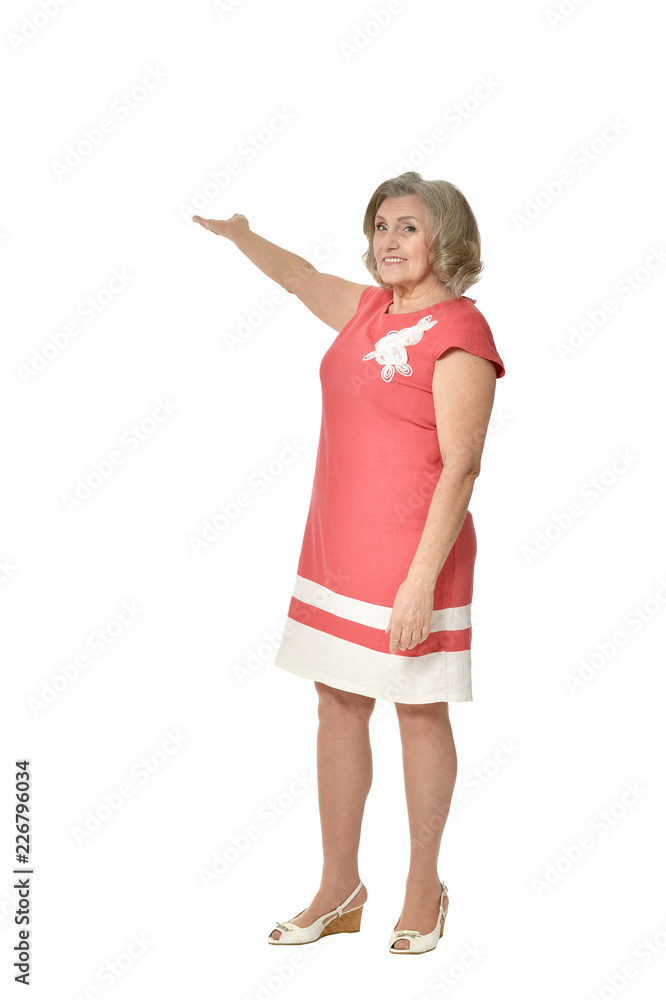 Portrait of a senior woman showing something on white background Portrait of a senior woman showing something on white background