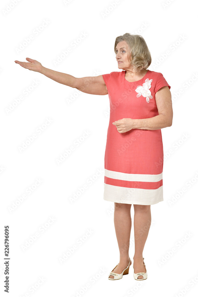 Portrait of a senior woman showing something on white background Portrait of a senior woman showing something on white background