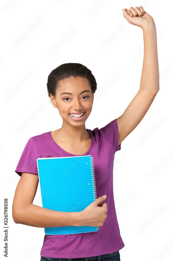 Friendly Young Girl Celebrating and Holding Note Pad - Isolated Friendly Young Girl Celebrating and Holding Note Pad - Isolated
