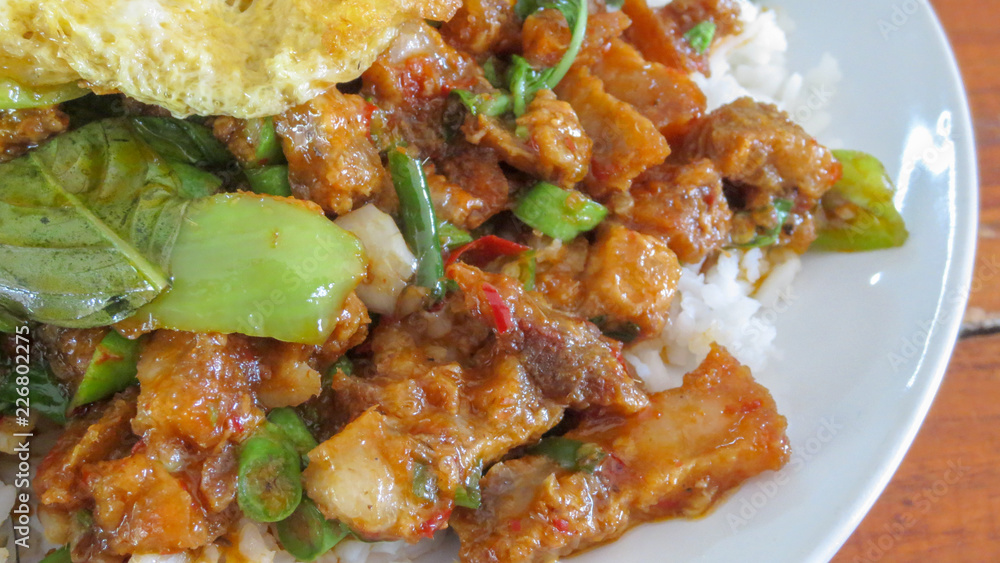 spicy herb curry with grilled pork and rice in thailand spicy herb curry with grilled pork and rice in thailand