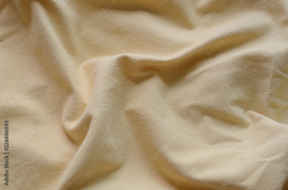 Top view of messy yellow color bed sheet texture background. Top view of messy yellow color bed sheet texture background.