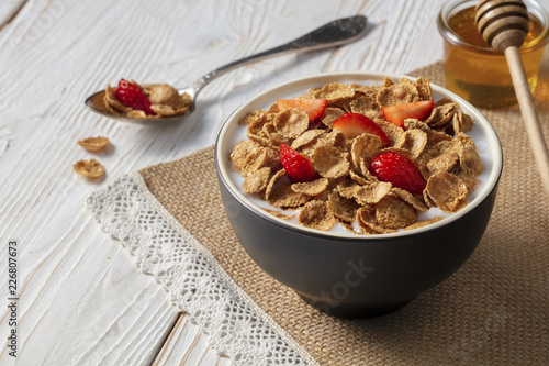 Breakfast of oatmeal with strawberries.