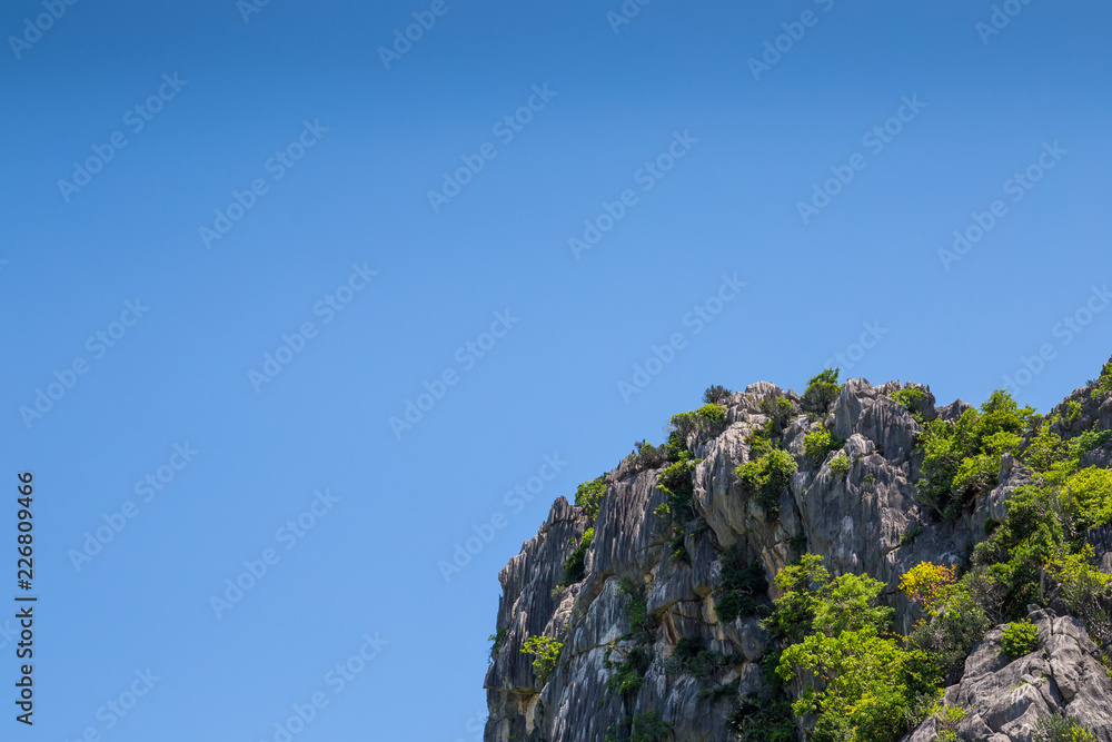 Mountainous views with bright blue skies as background scenes. At Khao Sam Roi Yot in Kui Buri District, Prachuap Khiri Khan Province, Thailand.