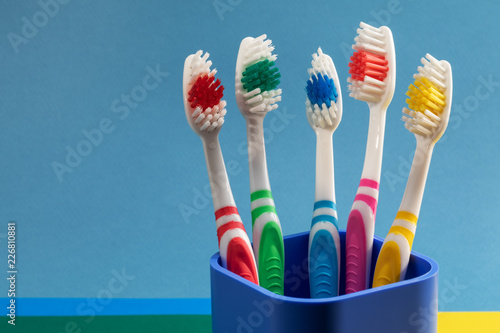 multi-colored toothbrushes in a plastic   up