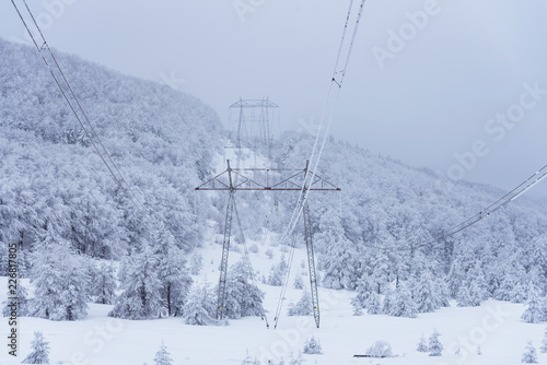 High voltage power lines in the winter. © ba11istic