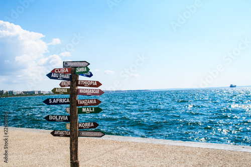 The seafront in the city of Thessaloniki, Greece. Mediterranean Sea, holiday resort.Road sign