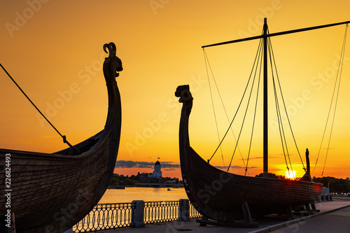 Silhouettes of old ships on sunset background, embankment of Vyborg, Vyborg Bay, Leningrad Region, Russia. August 2018.