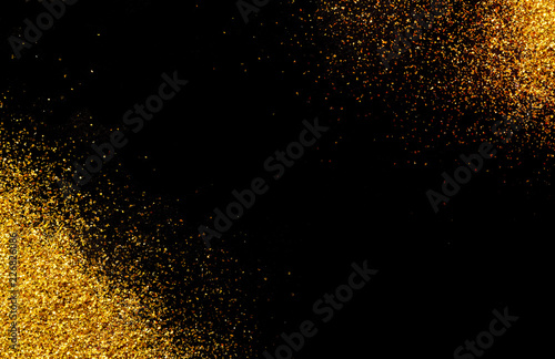 Black background with gold glitter in the corners.