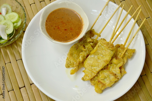 pork satay with peanut sauce and pickled vegetable cup