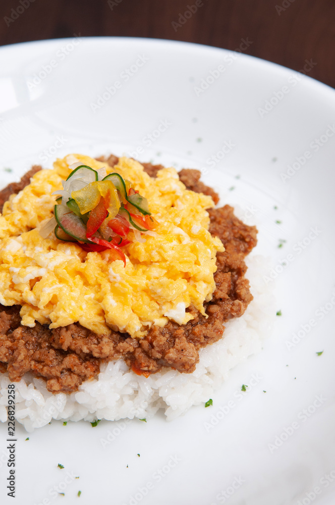 Japanese spicy Tan Tan pork over rice with scramble egg Japanese spicy Tan Tan pork over rice with scramble egg