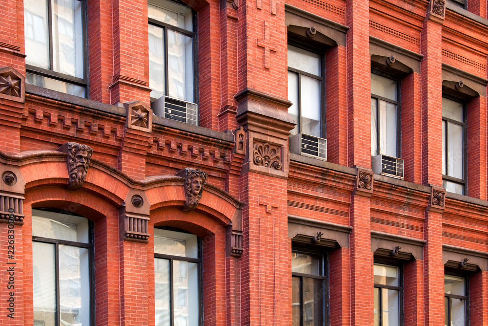 Fototapeta premium Facade of an old brick building in New York