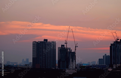 Impressive sunset sky over the constructing area of Bangkok, Thailand 