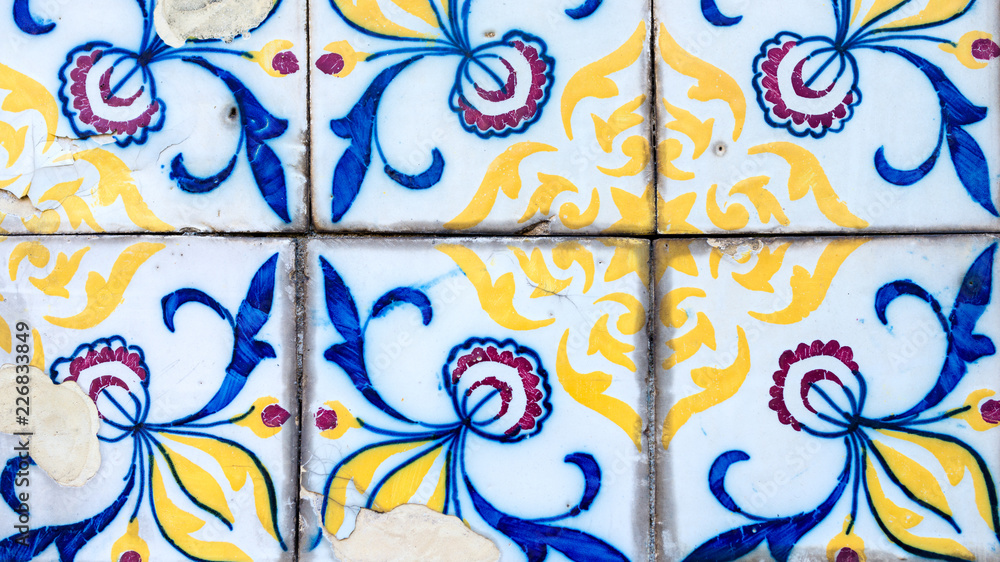 Traditional decoration of the facade of the house in Porto. Typical Portuguese and Spanish ceramic tiles azulejos