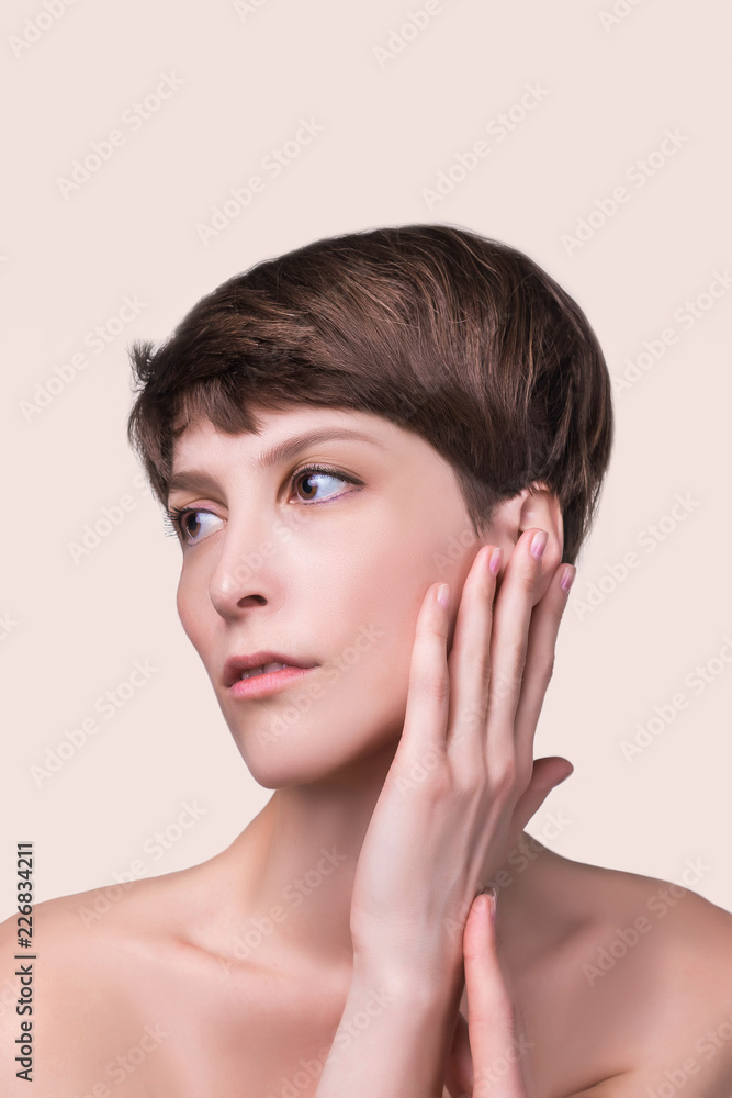 Beautiful woman. Female face close up. Portrait of young caucasian woman at studio isolated on pastel. Fresh skin and beauty concept. Short haircut, long neck, perfect skin Beautiful woman. Female face close up. Portrait of young caucasian woman at studio isolated on pastel. Fresh skin and beauty concept. Short haircut, long neck, perfect skin