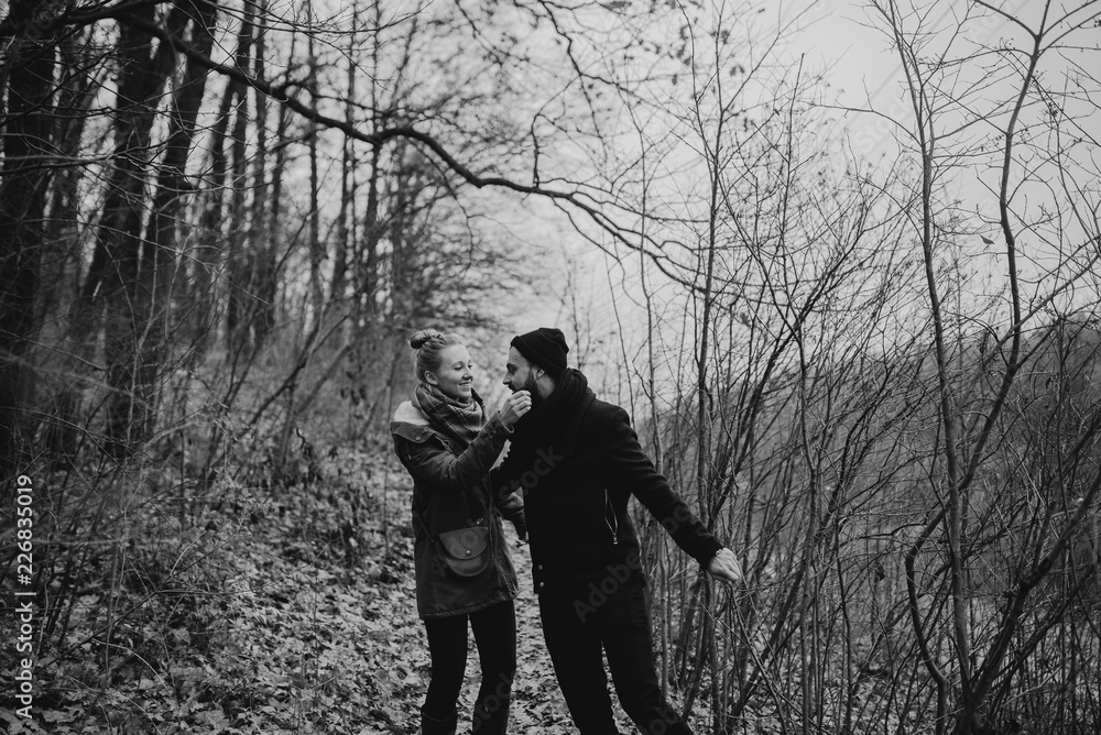 Black and white portrait of couple. Young couple in love and fun, hug and travel in the nature. The concept of tenderness and affection. Romantic photo. Black and white portrait of couple. Young couple in love and fun, hug and travel in the nature. The concept of tenderness and affection. Romantic photo.