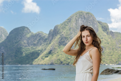 Beautiful amazing nature background. Tropical blue sun sea in Philippines . Luxury holiday resort. Island coral reef. Fresh freedom. Adventure day. Coconut paradise. Woman has long dress © Sokirlov