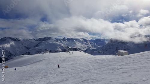 Image of ski resort in the winter with snow covered mountains and slops