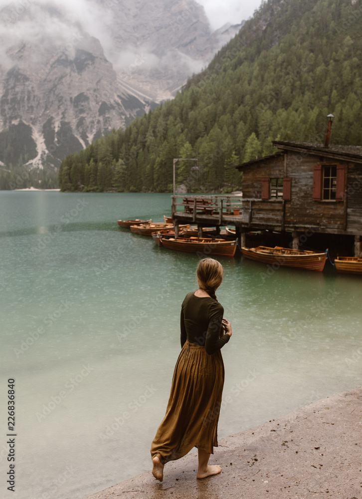 Woman at a moumtain lake in Italy