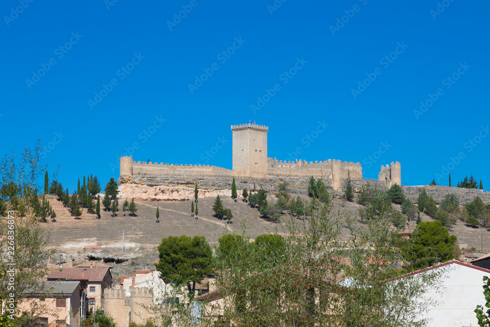 old wall and turret of castle in Penaranda de Duero village, landmark and public monument from eleventh century, in Burgos, Castile and Leon, Spain, Europe