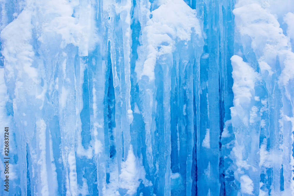 Natural icicles hanging from a hill in a severe winter Natural icicles hanging from a hill in a severe winter