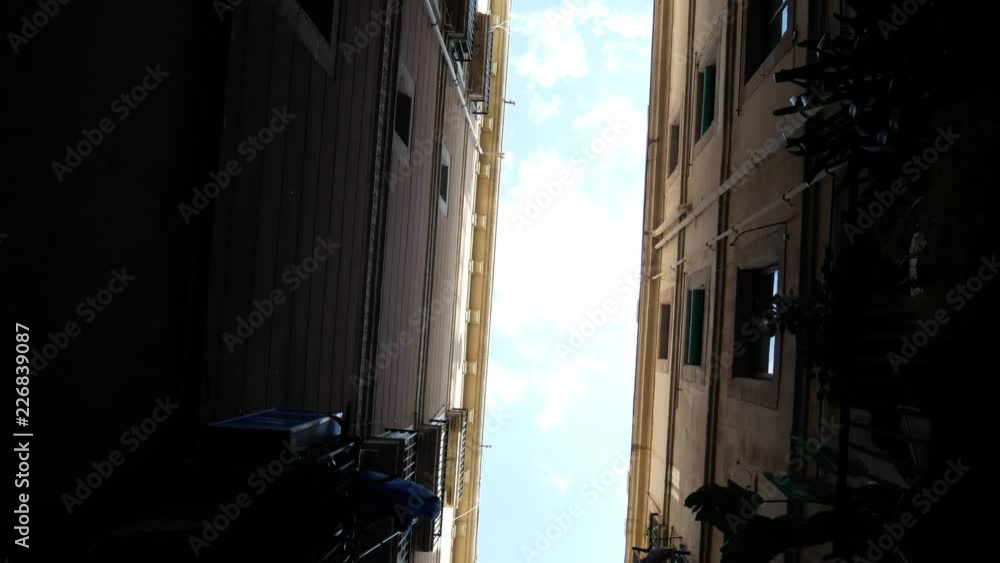 View of the sky between two buildings View of the sky between two buildings