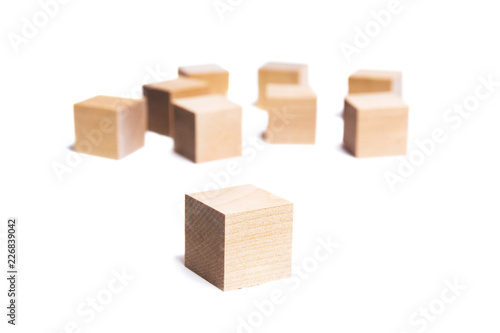 Wooden cubes on white background. Construction of wooden cubes. Isolated on white