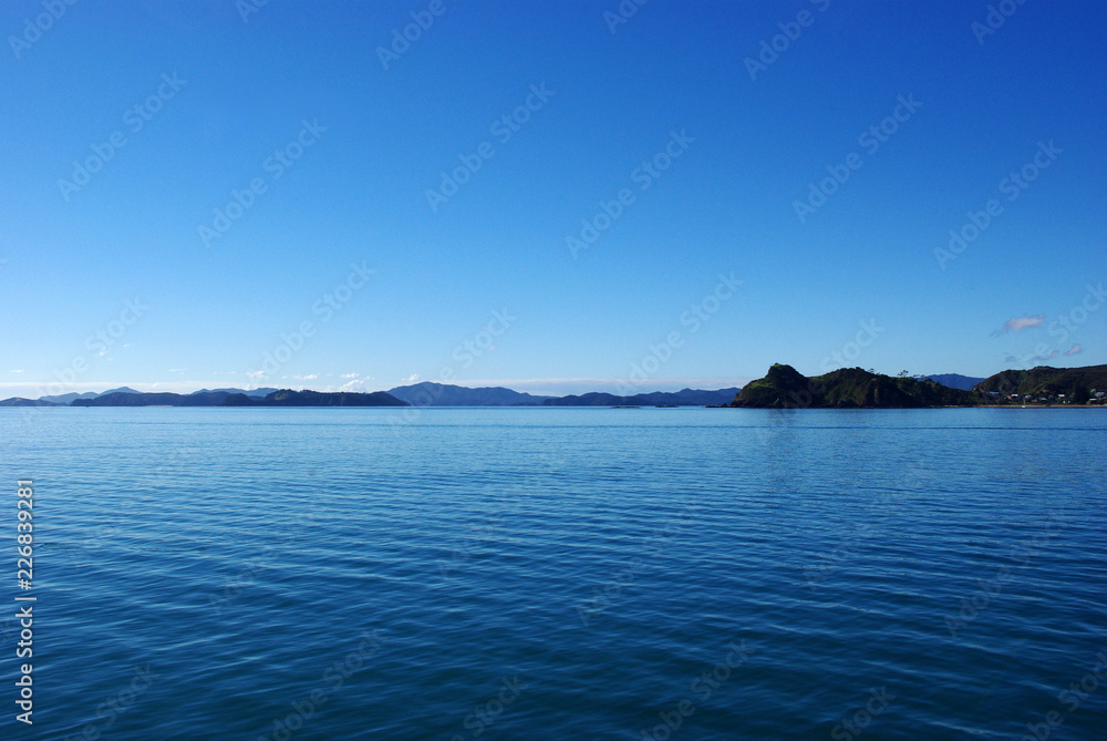 View of the sea and islands from a boat in Bay of Islands, New Zealand.