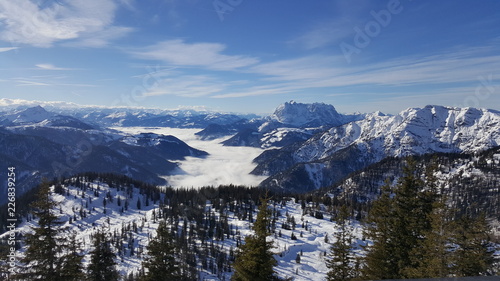 Image of ski resort in the mountains with low stratus over the valleys