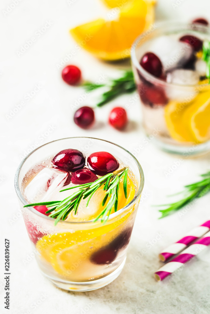 Citrus cranberry rosemary cocktail. Selective focus, space for text. Citrus cranberry rosemary cocktail. Selective focus, space for text.