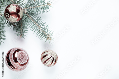 New year  Christmas decoration. Fir branches with toys balls on a background of fabric.