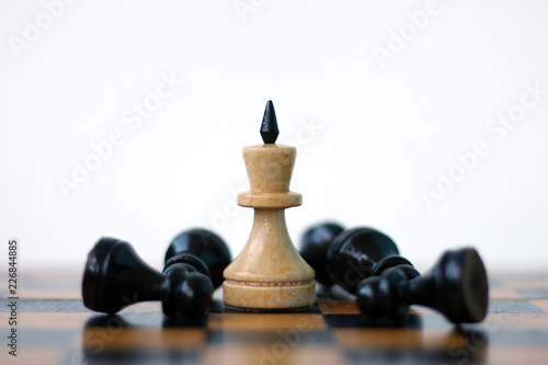 White king and black pawns.