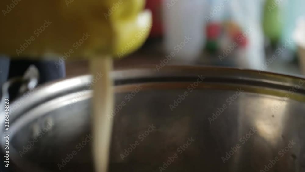 Video clip from the cheese factory. Woman stretches the cheese mass. Chechil homemade cheese production. Video clip from the cheese factory. Woman stretches the cheese mass. Chechil homemade cheese production.
