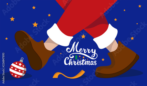 Santa Claus stepping on a red Christmas ball with ribbon. Merry Christmas.