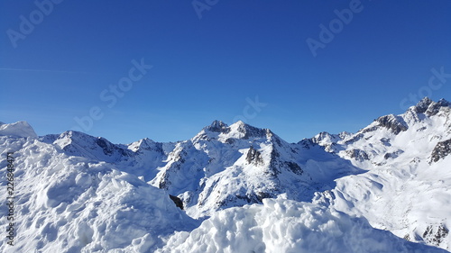 Image of snow covered mountain peaks in the alps © Alex