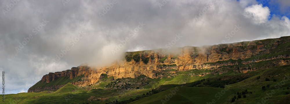 Panoramic view of the mountain plateau in the clouds in the summer,  North Caucasus in Russia.