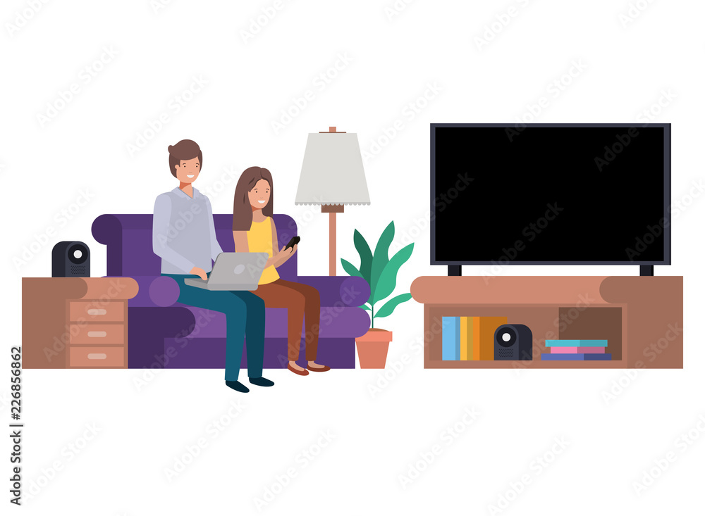 couple sitting in the living room with laptop couple sitting in the living room with laptop