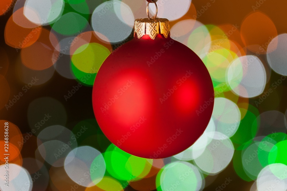 Christmas Bauble Hanging with the Green Blurry Light on the