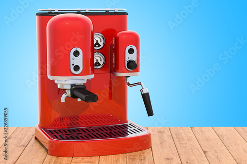 Fototapeta Red coffeemaker or coffee machine retro design on the wooden table