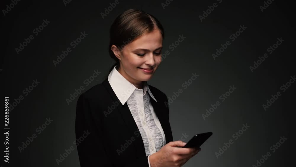 Attractive brunette bussines woman with phone texting Attractive brunette bussines woman with phone texting