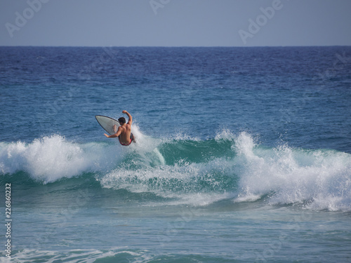 surfer jumping on the wave